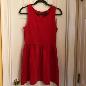 Red skater dress with black zipper detail